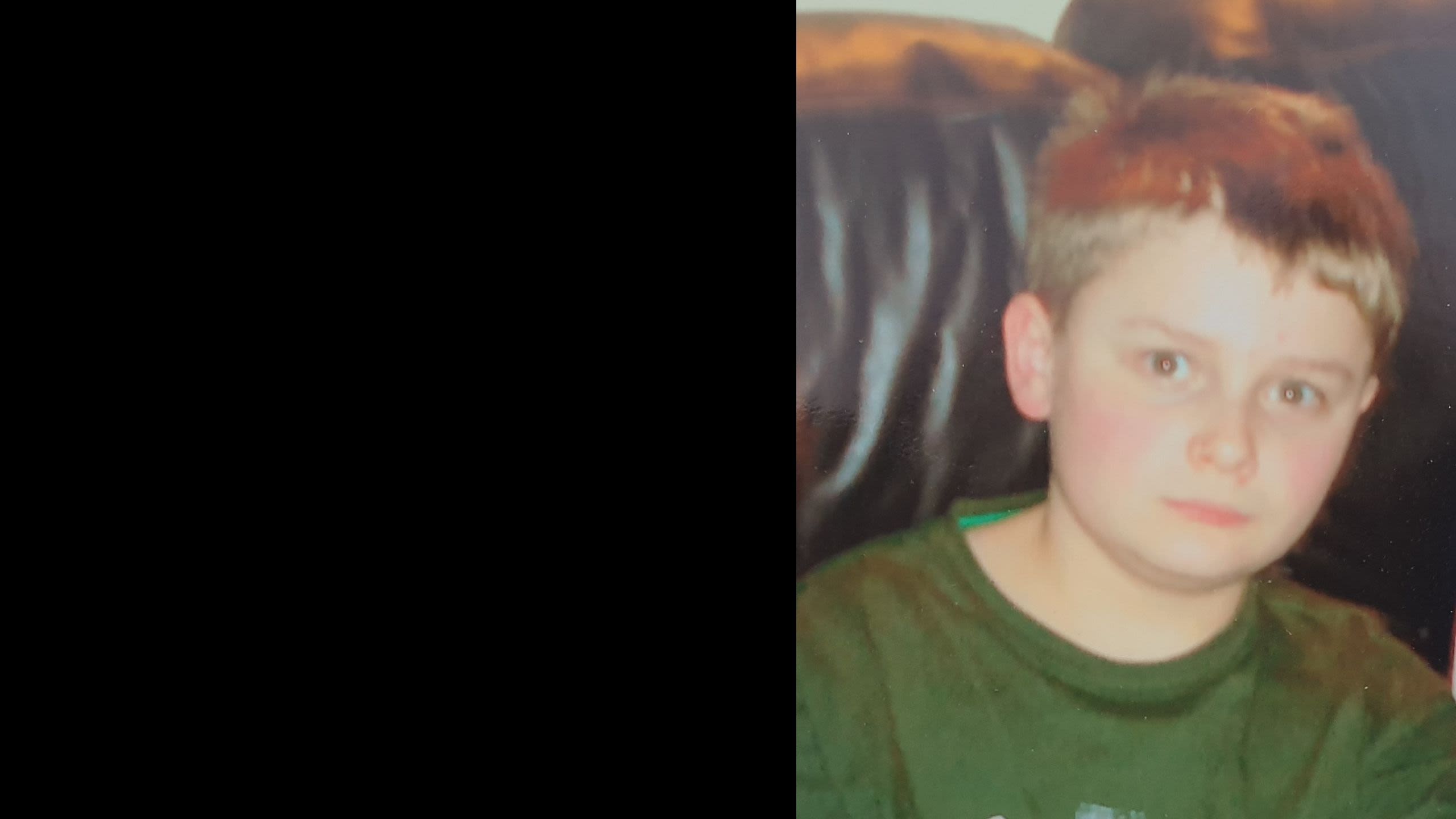 Liam age 9 wearing a green t shirt
